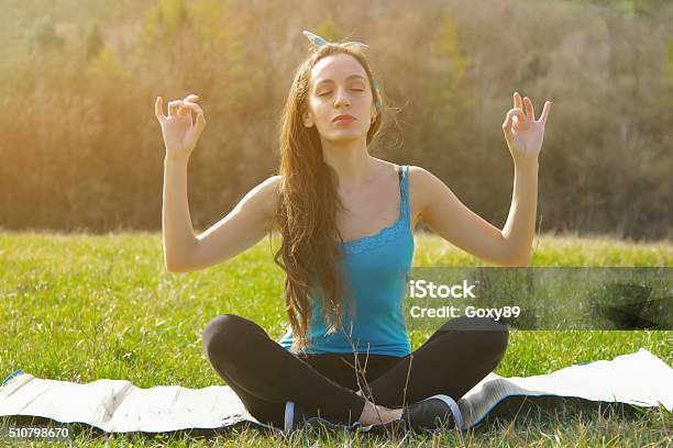 Beautiful girls teen friend do yoga for healthy in green park holiday  sitting hand lotus eyes closed concentration posture Stock Photo - Alamy