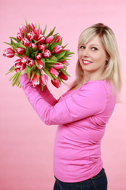 istock Pretty woman with tulips 510798964