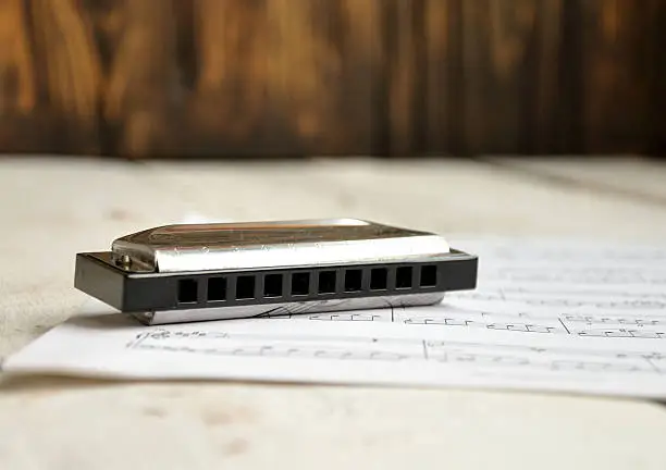 harmonica on a wooden table