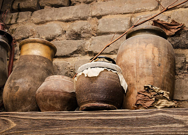 Old pottery and glass flasks with a kerosene lamp