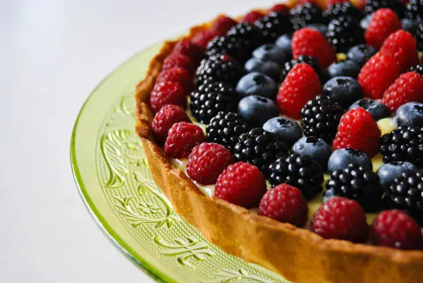 Close up of a cream pie with wildberries. Food. Fruit dessert