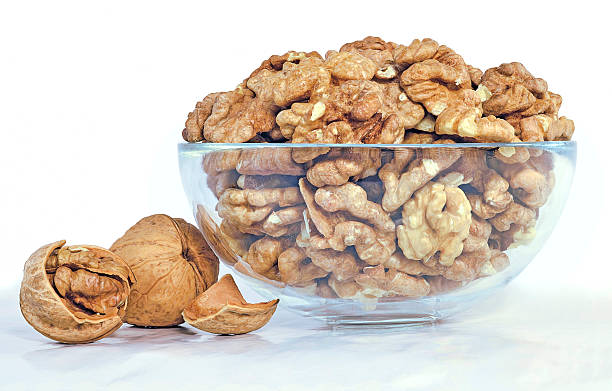 istock walnuts in shell or peeled in a glass bowl 510803014