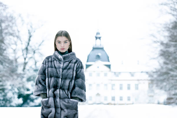 Beautiful girl wearing a mink fur coat