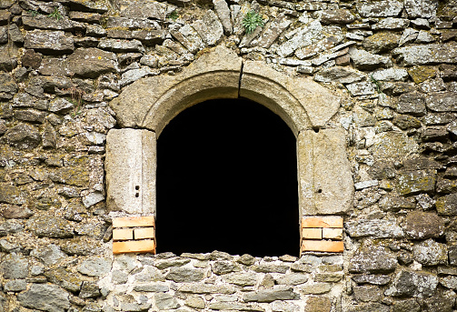 Window of a beautiful old stone monastery ruin with copy space