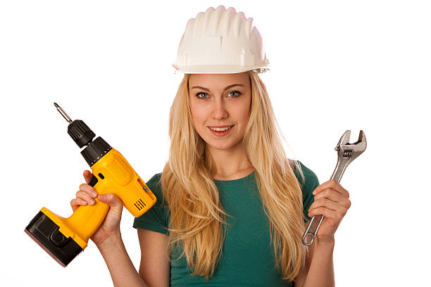 istock Woman with constructor helmet, screwdriver and wrench isolated 510844388