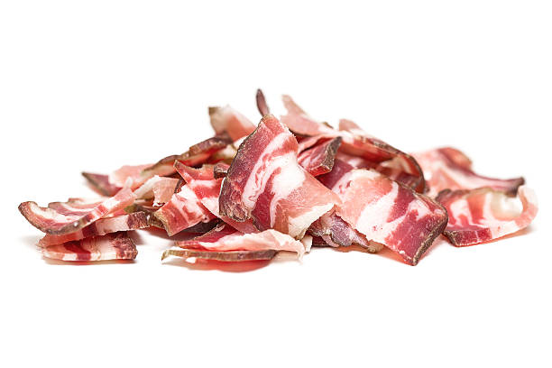 Fresh, sliced bacon isolated on white background stock photo