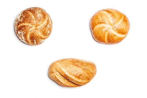 High angle view on three different bread rolls on white background, cutout isolated.