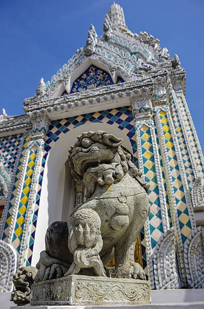 istock Ancient lion sculpture works in Wat Prakeaw Morakoth, Bangkok Th 510849364