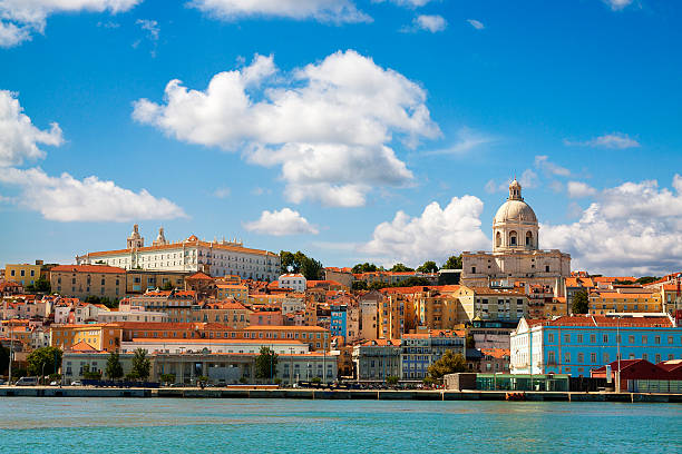 Beautiful view of Lisbon from the Tagus River. Beautiful view of Lisbon from the Tagus River. The scene is dominated by the Pantheon on the right hand side and the convent of Sao Vicent da Fora at upper left.  This is the view that greets visitors arriving by cruise ship. lisbon stock pictures, royalty-free photos & images