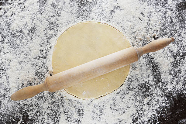 istock Wooden rolling pin and dough 510851480