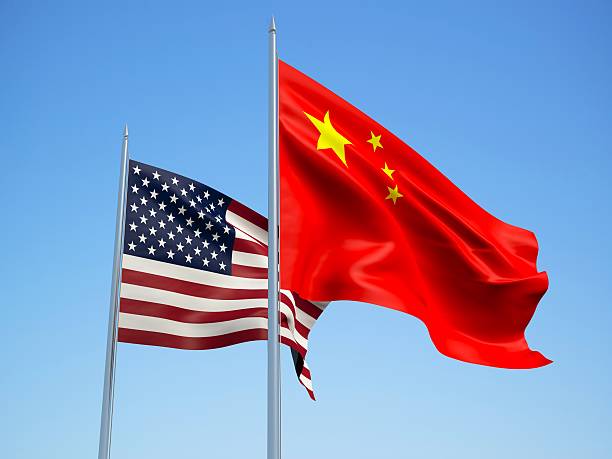 istock USA and China flags. 3d illustration 510851586