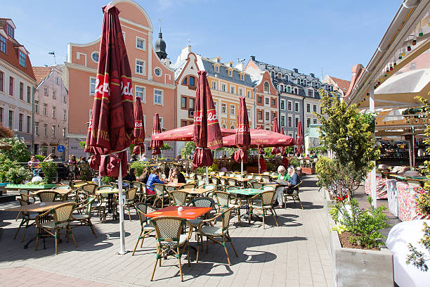 Riga, Latvia - May 16, 2014: Riga is the capital of Latvia. Riga's historical centre is a UNESCO World Heritage Site. The picture shows one of many street cafe.