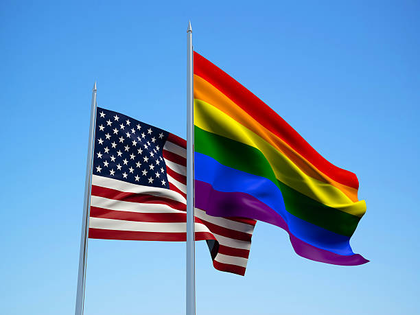 istock USA and Rainbow flags. 3d illustration 510852728