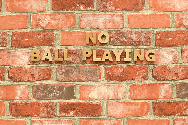 istock No Ball Playing handing on Brick Wall 510853174