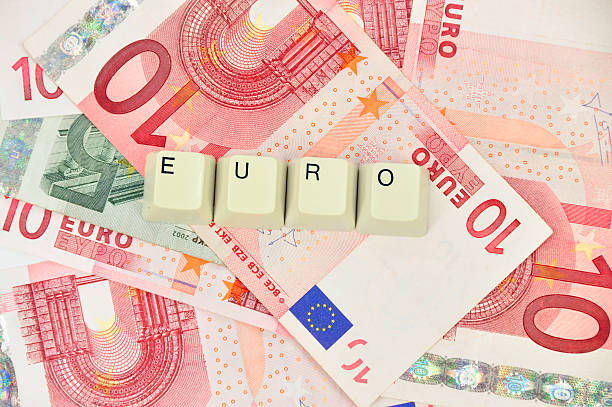 istock Euro currency background and the word EURO from computer keys 510853200