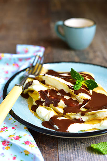 istock Thin pancakes stuffed with mascarpone and whipped cream. 510853754