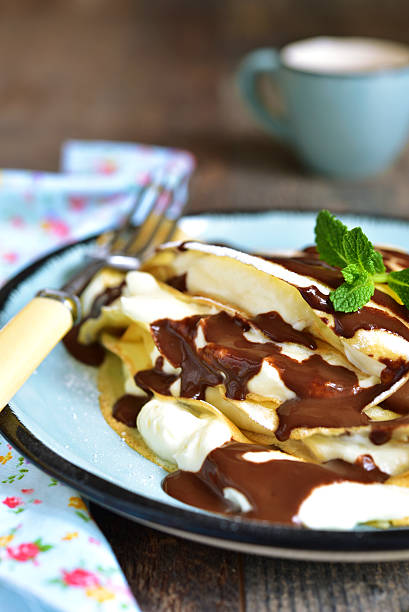 istock Thin pancakes stuffed with mascarpone and whipped cream. 510854030