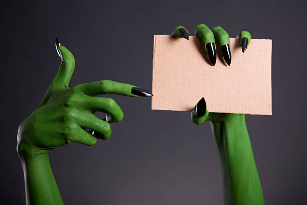 istock Green monster hand with black nails 510855888