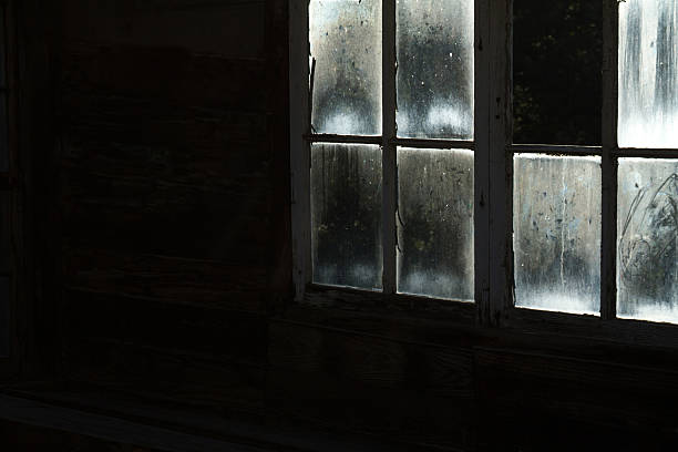 istock Grungy Spooky Illuminated Old Window Panes, Black Background 510856804