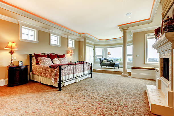 istock Beautiful master bedroom with elegant bedding and a glass door. 510859040