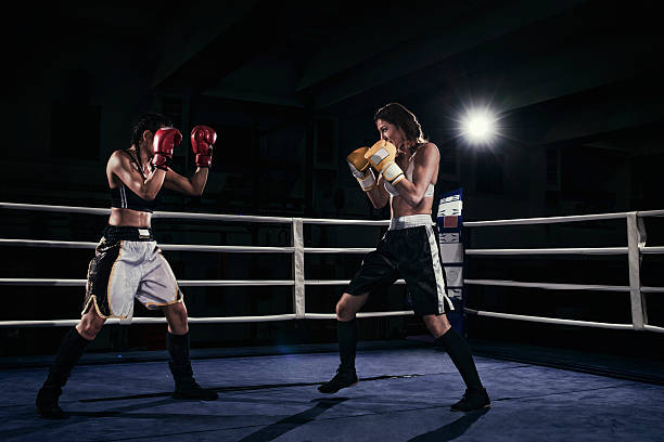 istock Female boxers fighting in a boxing ring 510859524
