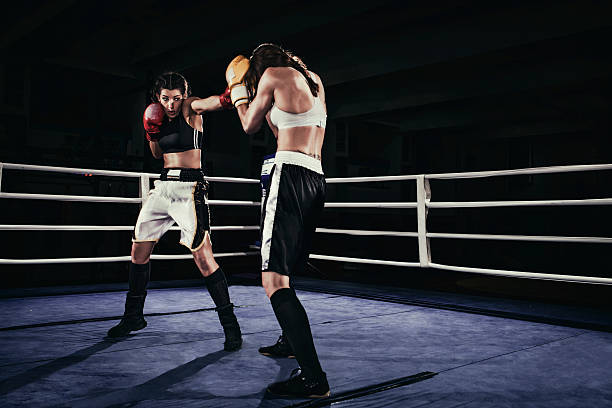 istock Female boxers fighting in a boxing ring 510859610