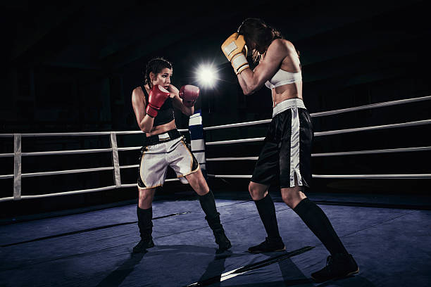 istock Female boxers fighting in a boxing ring 510859766