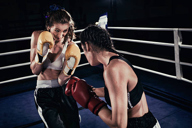 istock Female boxers fighting in a boxing ring 510859912