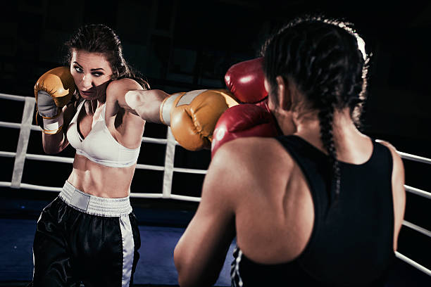 istock Female boxers fighting in a boxing ring 510860082