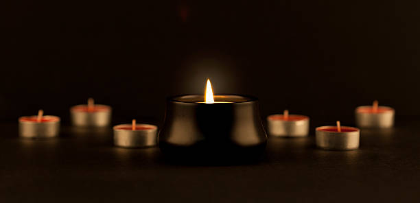 istock many extinguished and one burned candle 510863122