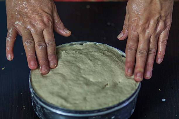 Baker kneading dough stock photo