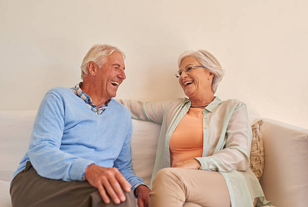 istock Senior couple at home together having funny conversation 510864422