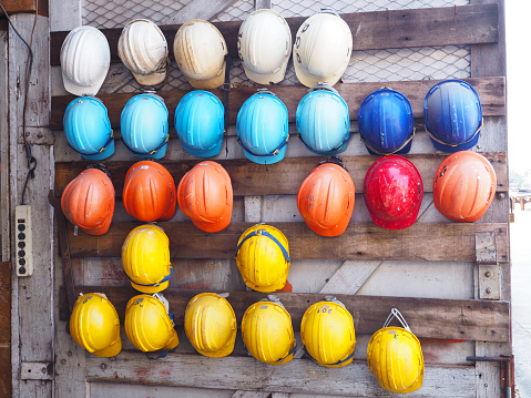 old colorful construction helmets