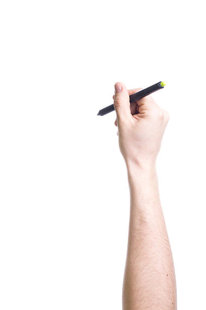 istock Hand holding a black pen isolated on white background 510866845