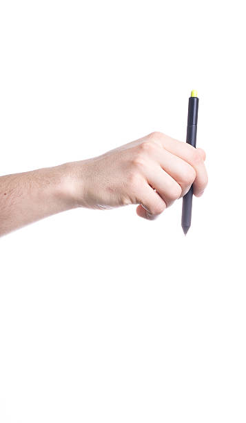 istock Hand holding a black pen isolated on white background 510866849