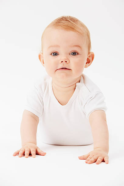 istock Young baby girl crawling on front, portrait 510867363