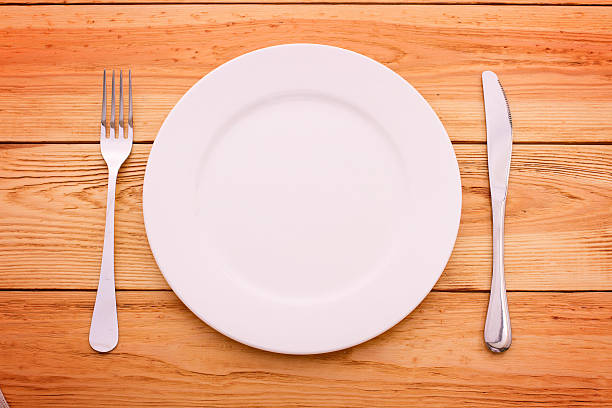 istock Cutlery red checkered tablecloth tartan on  wooden table top view. 510867839