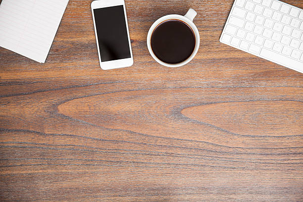 istock Wooden desk with a smartphone 510867862