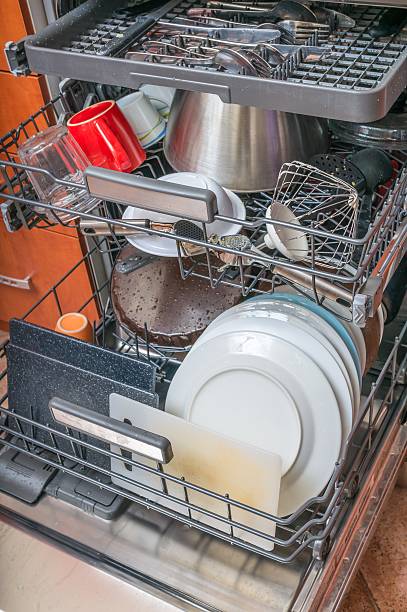 istock Dishwasher in kitchen and dirty dishes inside. 510868904
