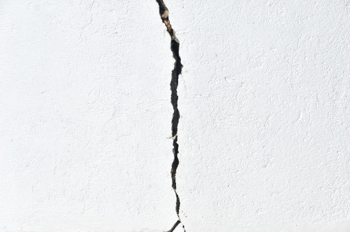 Cracked white wall texture background