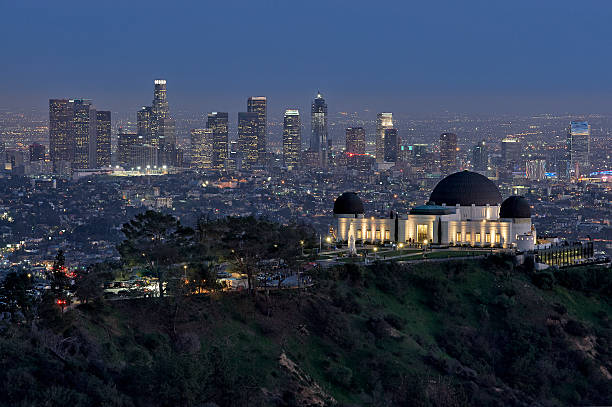 Los Angeles Skyline Los Angeles skyline with the Griffith Observatory in the foreground griffith park observatory stock pictures, royalty-free photos & images