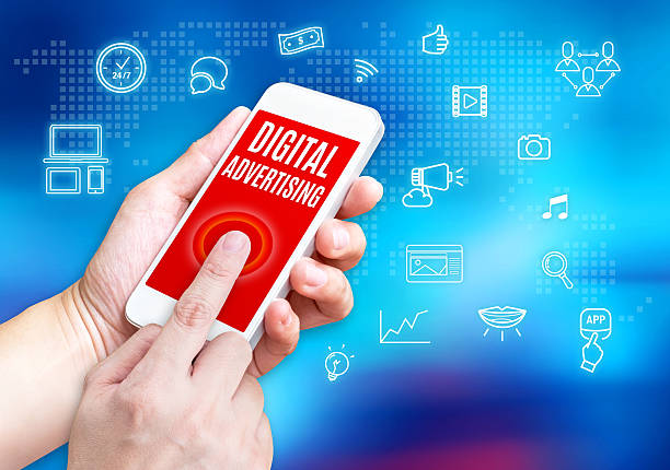 istock Hand holding mobile phone with Digital Advertising word with rel 510870418