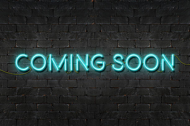 "COMING SOON" neon sign shining on black brick wall "COMING SOON" neon sign shining on black brick wall,Business concept. announcement message photos stock pictures, royalty-free photos & images