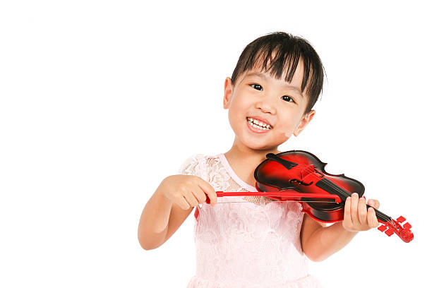 Chinese Little Girl Playing Violin on a white background