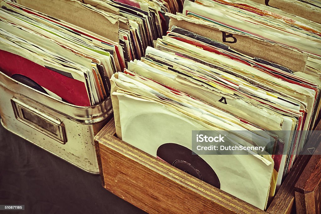 Retro styled image of lp records on a flee market Retro styled image of boxes with vinyl turntable records on a flee market Record - Analog Audio Stock Photo