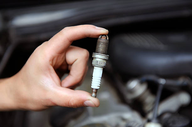 istock Auto mechanic holds an spark plug 510871225