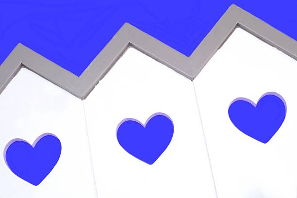 House Model With Windows In The Shape Of A Heart White Small House Wooden Model With Three Windows In The Shape Of A Heart Isolated On The Blue Background, Close Up, Image, Concept menage trois stock pictures, royalty-free photos & images