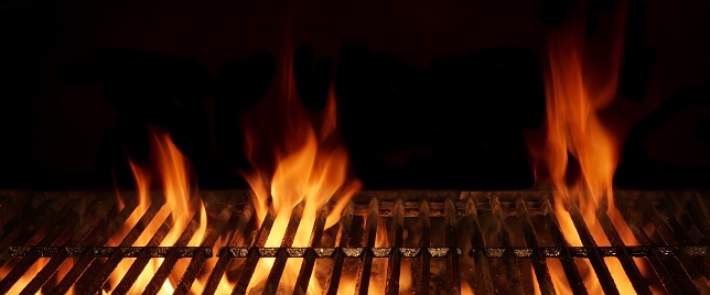 Empty And Clean Hot Flaming Charcoal Barbecue Grill With Bright Flame Isolated On Black Background. Party, Picnic, Braai, Cookout Concept