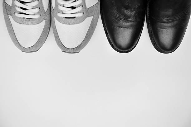 istock Business shoes and sneaker on white with copyspace 510871641