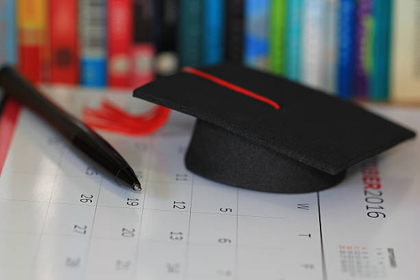 istock pen and graduation hat, education concept 510871742